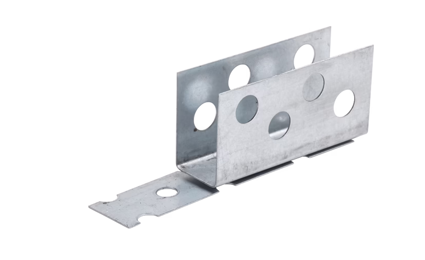 codex_Dummy_X-Board connector_2022-06 Close-up product photograph of a galvanized steel bracket assembly isolated on a white background. The component consists of a U-shaped channel section and an attached flat mounting plate; both parts feature several circular punched holes for screws or fasteners. The metal surface is silvery-gray with a matte, slightly textured zinc coating; visible edges, bends and small tooling marks indicate industrial manufacture. The low-angle perspective reveals the interior of the channel and an extended flat tab with a single round hole, suggesting use for structural support, framing, HVAC assemblies or general mounting applications.